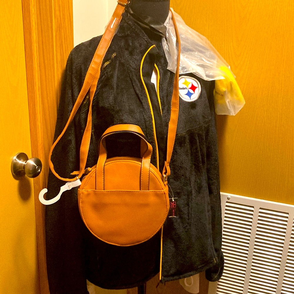 This is brand new with tag, caramel, not leather